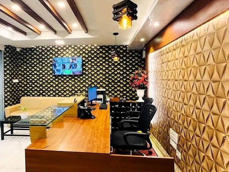 Reception desk with a gold geometric wall