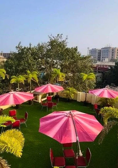 Rooftop garden with parasols and lawn seating