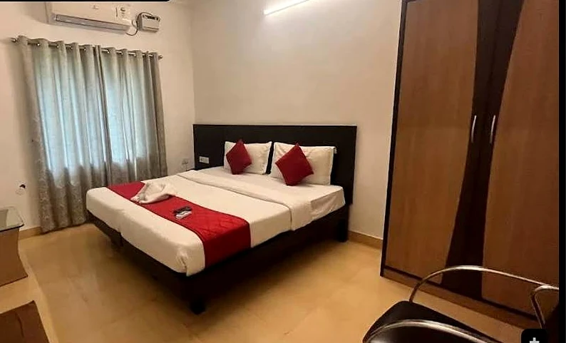 Super Deluxe room with a red bed runner