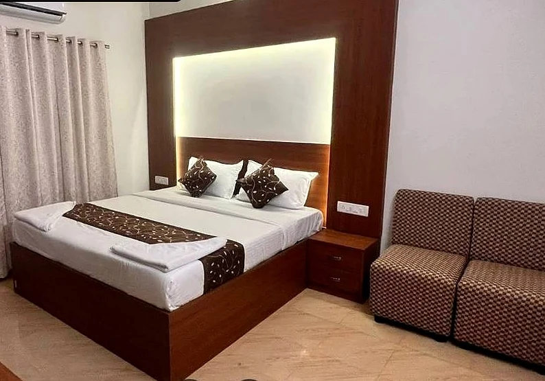 Suite with a back-lit headboard and seating