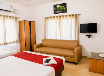 Triple Bed room with a sofa and TV